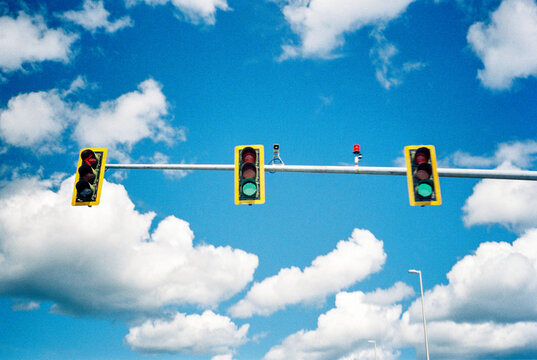 Traffic lights with blue sky and clouds