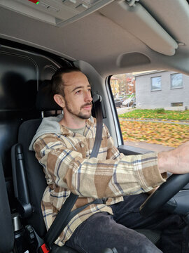 Focused Tradesman Driving Commercial Service Van