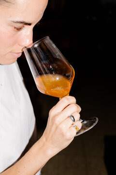 Woman appreciating aroma and flavor of wine during a tasting