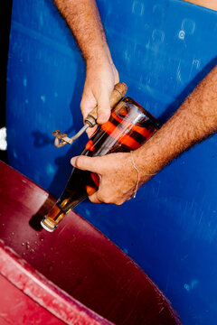 Wine craftsman preparing for the traditional disgorging process