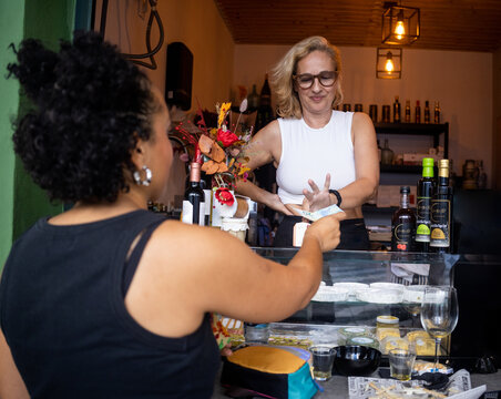 Business woman accepts cash payment