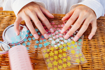 Pimple patches in the form of multicolored stars lie on the table 