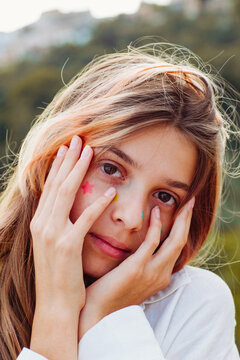 A pre-teen stuck many pimple patches in the shape of colorful stars