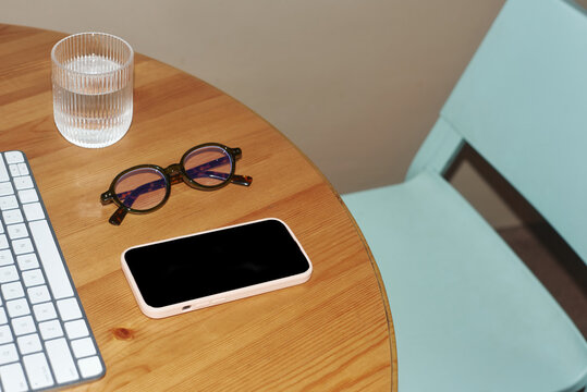 Working table with phone and glasses