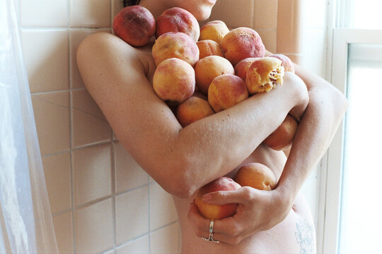 Arms Holding Peaches