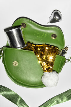 Golden Sequin Santa Hat, Canned Food, and Xmas Toy in Green Handbag