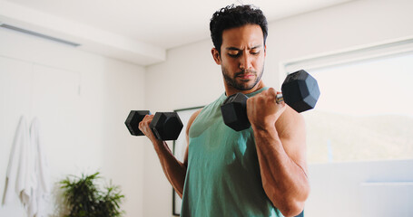Fitness, man and weightlifting in home with dumbbells for strength training, workout or...