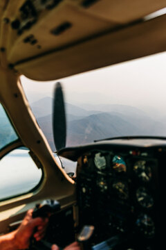 View From A Small Plane Cockpit Over Mountain Range During flight