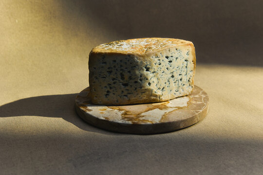 Blue Cheese Block On Rustic Round Board