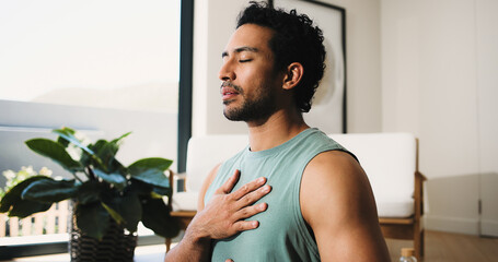 Meditation, calm man or home for breathing routine, relaxation or body awareness practice for wellness. Mindfulness, inner peace or person with holistic breathwork exercise, yoga or mental health zen