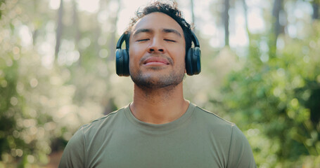 Headphones, peace and health with man in nature for streaming service, meditation sound and calm. Workout playlist, wellness podcast and music with person outdoor for zen audio, radio and relax