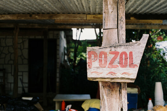 Film photo of an Rustic Pozol Signboard in Rustic Setting