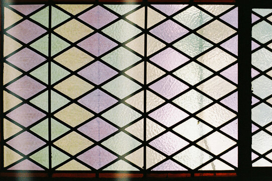 Film photo of Stained Glass Window with Colorful Geometric Patterns