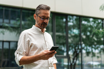 Professional Man in White Shirt Using Phone Outdoors 