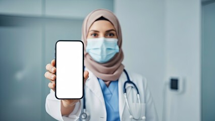 Medical Professional in Hijab and Mask Holds Smartphone with Blank Screen