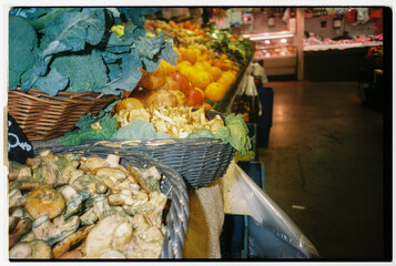 Fresh Vegetables and Fruits Displayed at a Lively Market