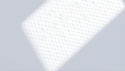 A closeup shot of a soft white watercolor paper texture with a subtle shadow cast across it creating a diagonal line of light and shade with white background