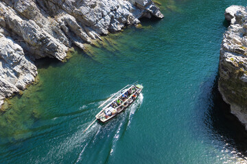 Landscape view of Oboke Gorge, Tokushima, Japan, the famous sightseeing of Iya Valley with turquoise water river and sightseeing boat, top angle view