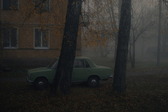 vintage car in autumn fog