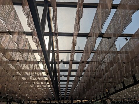 Elegant Ceiling Decor with Sheer Curtains and String Lights