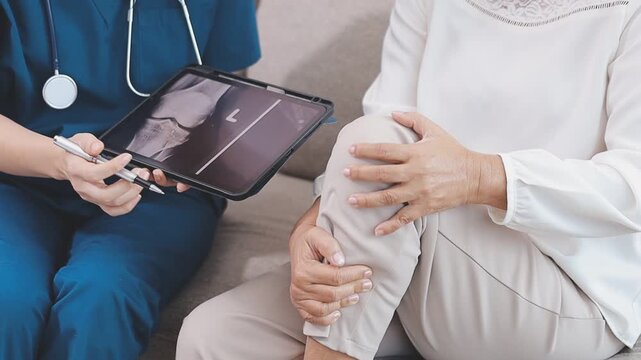 Homecare nursing service and elderly people cardiology healthcare. Close up of young hispanic female doctor nurse check mature caucasian man patient heartbeat using stethoscope during visit