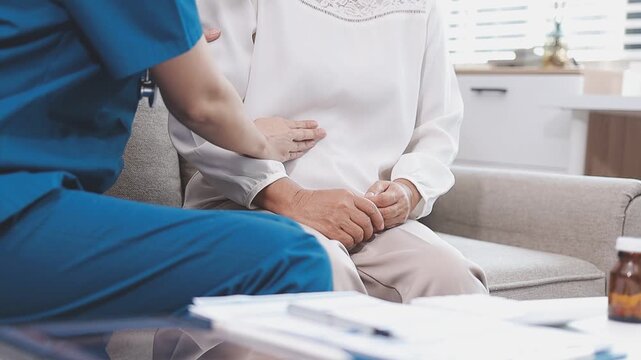 Homecare nursing service and elderly people cardiology healthcare. Close up of young hispanic female doctor nurse check mature caucasian man patient heartbeat using stethoscope during visit