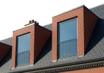 identical modern dormer windows with black steel juliet balconies set in deep red brick and textured charcoal slate roof against a vibrant azure sky, low angle, concept of sophisticated urban renewal