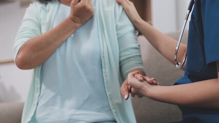 Doctor, patient and holding hands on desk in consultation room with support, empathy and announcement. Medic, person and care with comfort, diagnosis and helping with healthcare service at hospital