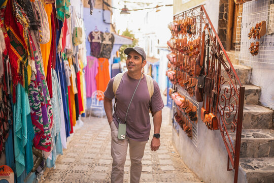 Man walking through market street in the medina of Chefchaouen