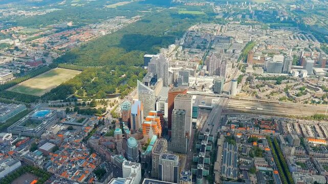 The Hague, Netherlands. Business center of The Hague. Large train station Den Haag Centraal. Cloudy weather. Summer day. Drone footage, Point of interest
