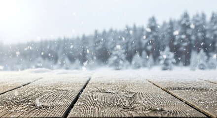 Snow covered wooden table with pine forest background and falling snowflakes winter