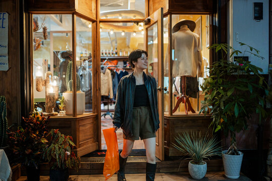 Woman leaving a vintage clothing store in Japan