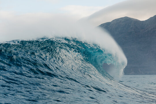 Huge wave breaking over the open sea off the coast