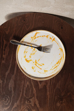 Empty Plate with Fork After Meal