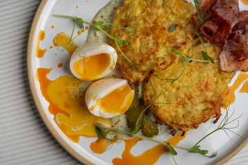 Breakfast Plate with Soft-Boiled Eggs, Hash Browns, and Bacon