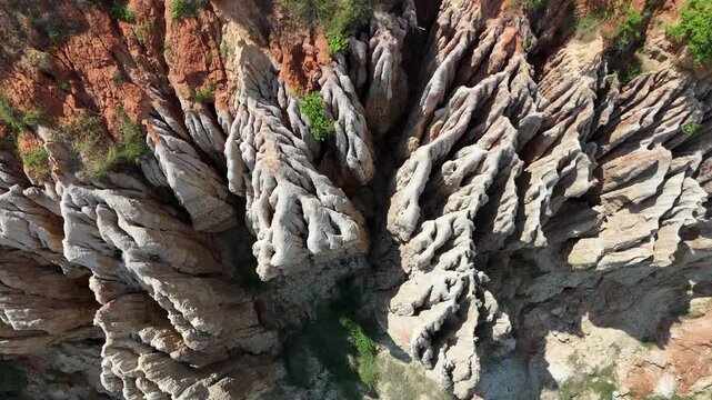 Stunning aerial panoramic view capturing the vast expanse of eroded clay cliffs at the Viewpoint of the Moon (Miradouro da Lua) Africa aerial top down rock shape formation