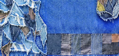 Ripped denim patch and destroyed torn denim blue scraps. Double color denim jeans fashion abstract background