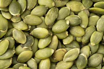 Green Pumpkin seeds isolated closeup photo.