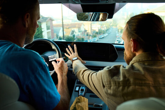 Two men are in a car.