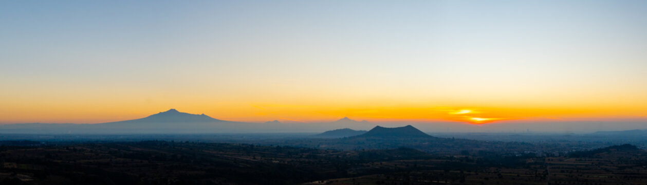 Malinche and pico de orizaba volcanoes at sunrise