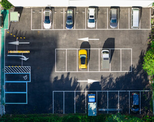 Aerial View of Parking Lot with Cars, Directional Arrows.
