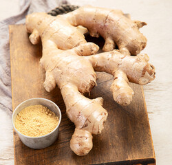 Fresh ginger with sliced and green leaves.
