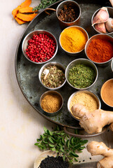 Different aromatic spices in bowls.