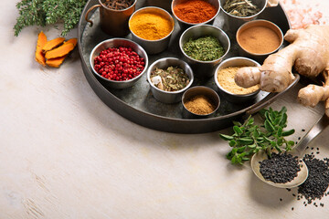 Different aromatic spices in bowls.