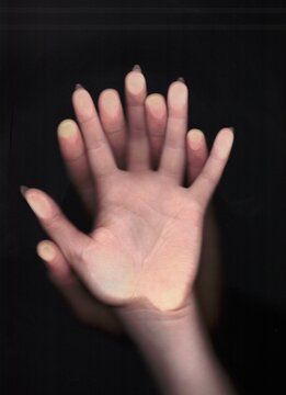 Scan of a man's hand on top of a woman's hand