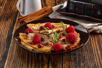 Sweet homemade pancakes with raspberry