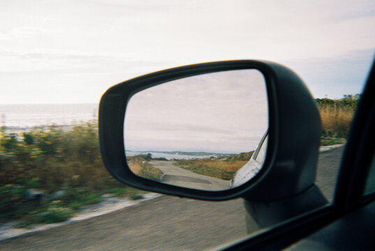 View of Peaks Island, Maine through car rear view mirror