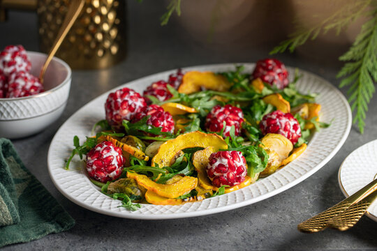 Festive Holiday Salad. Made with Goat Cheese, Pomegranates and Greens
