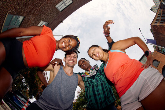 Group picture of happy athletes from below
