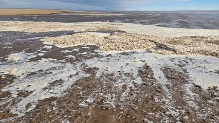 Water flowing into Lake Eyre transforming the dry salt pan into Australia's largest inland sea